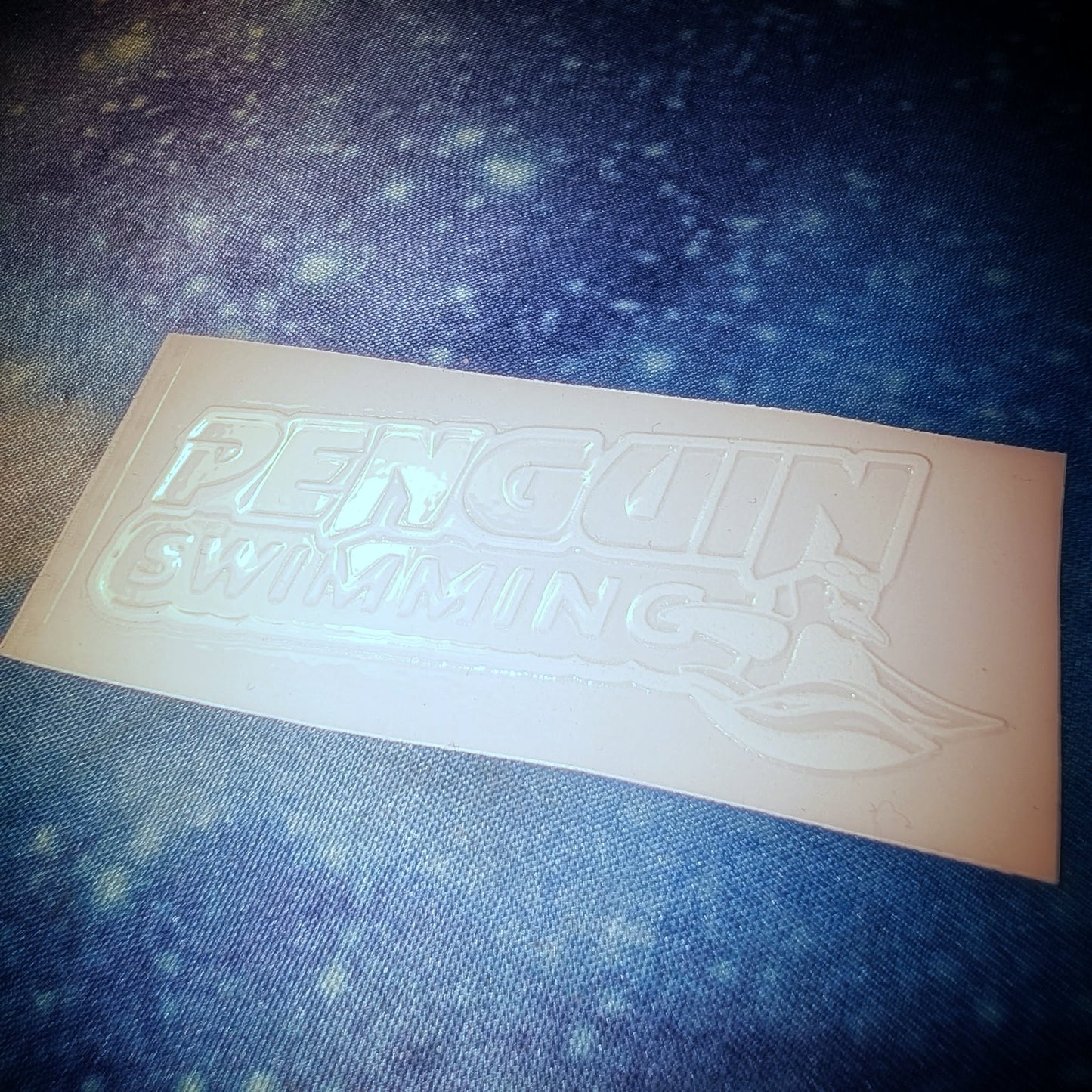 Penguin Swimming White Logo UV Sticker