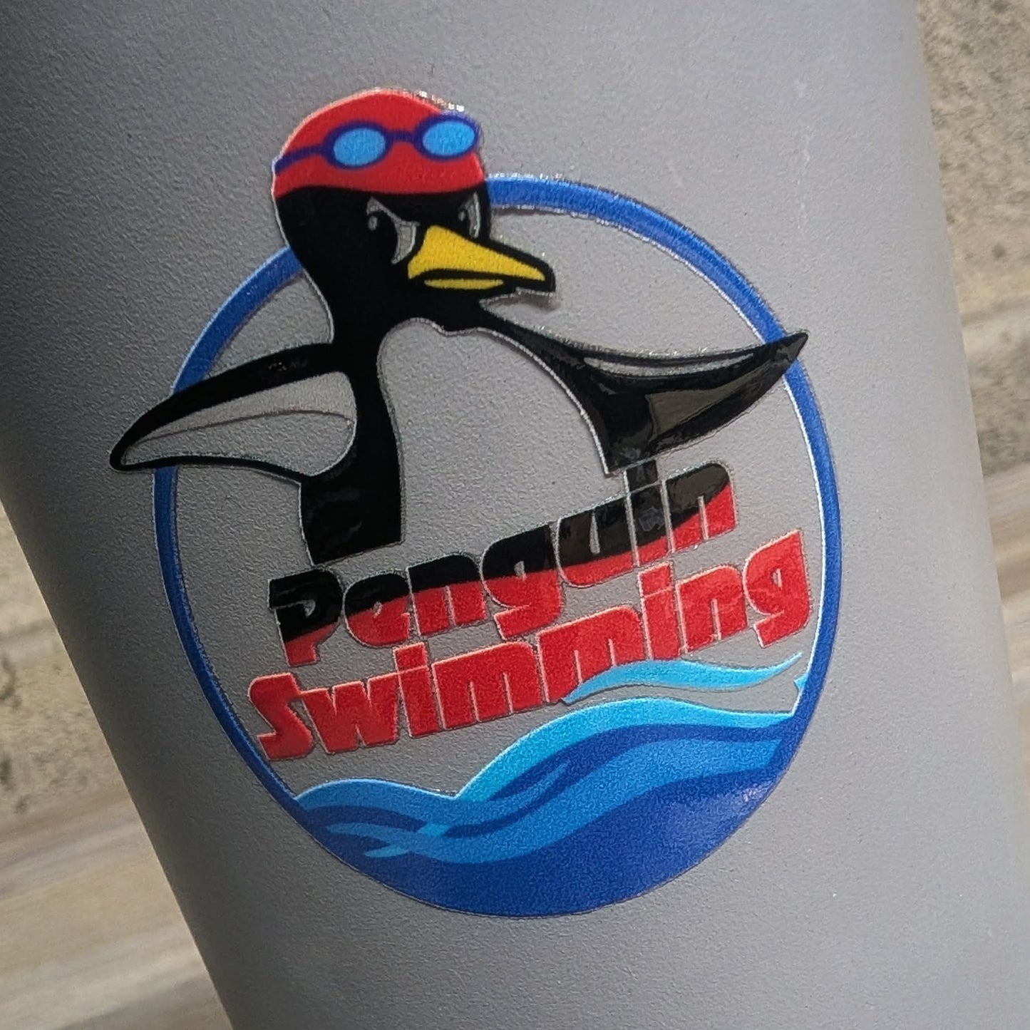 Penguin Swimming Circle Logo UV Sticker